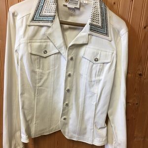 White denim jacket with embellishments.